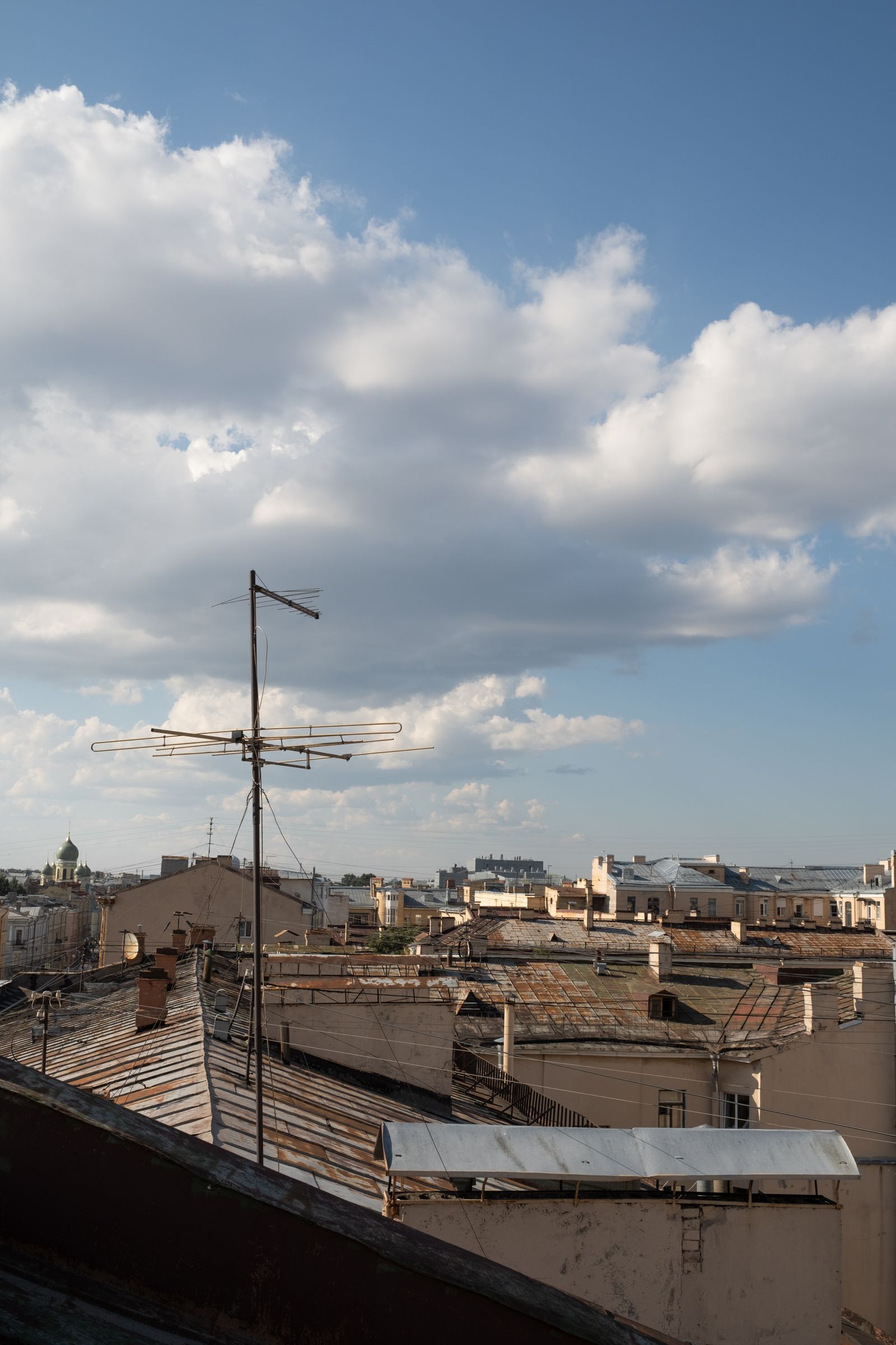 A rooftop overlooking a dense city skyline